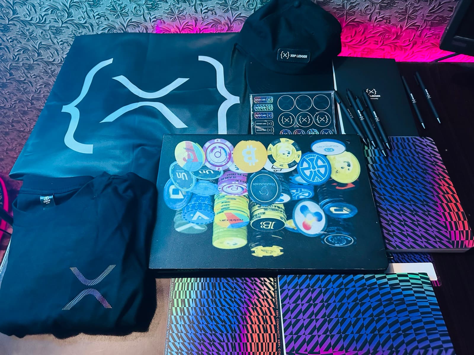 XRP Ledger ambassador swag including shirt, cap, bag and stationery